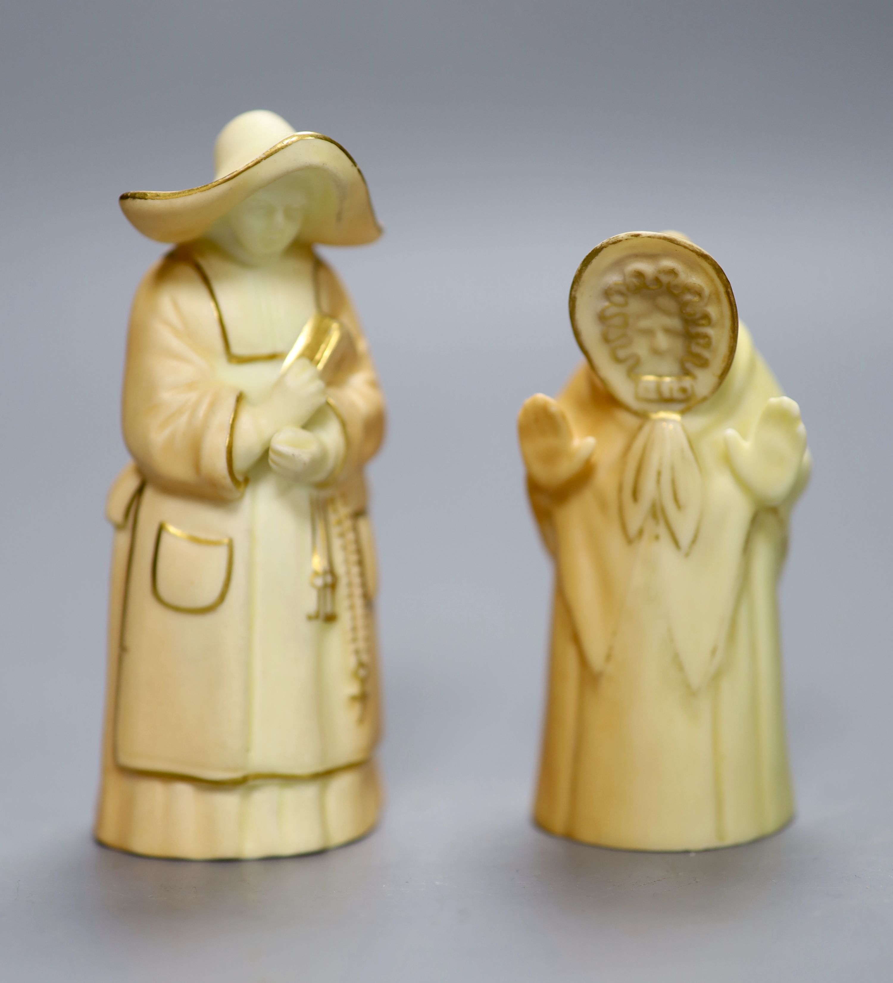 Two Royal Worcester blush ivory candle snuffers of Granny Snow and The Nun, date codes 1933 and 1920, height 10cm